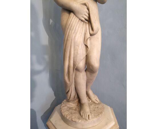 White marble statue with base, depicting Venus     